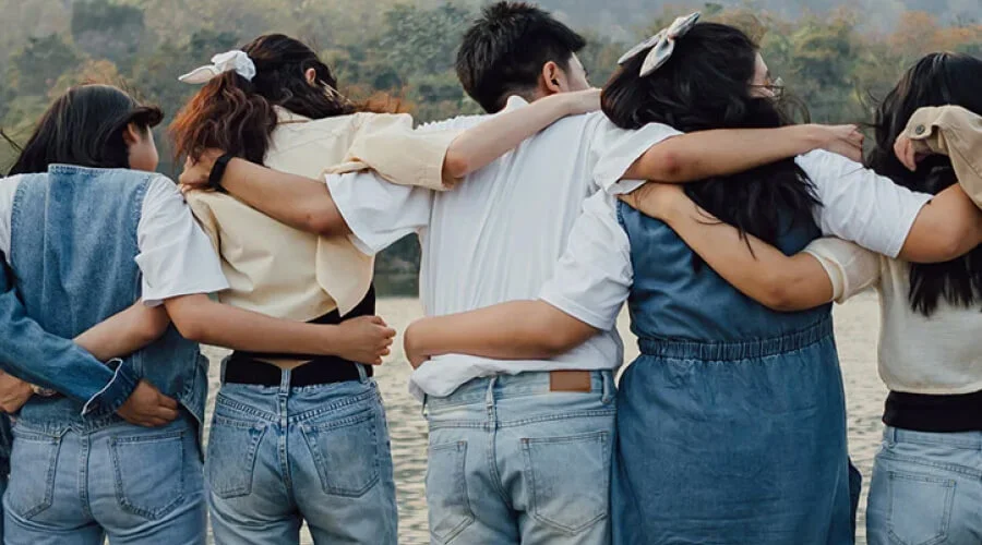a group of people hugging each other