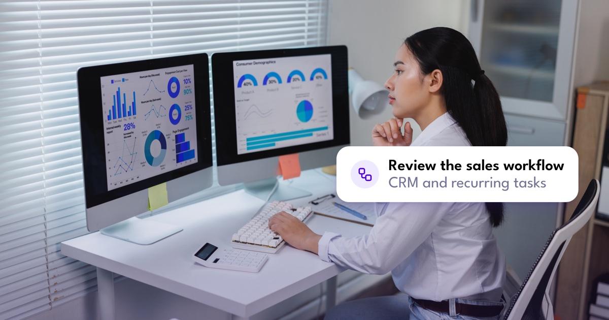 A sales worker reviews CRM workflows before automating tasks.